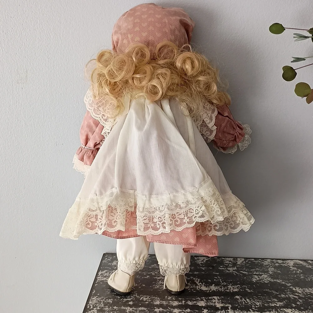 Vintage Porcelain Doll with Pink Dress and Bonnet by Dynasty Dolls